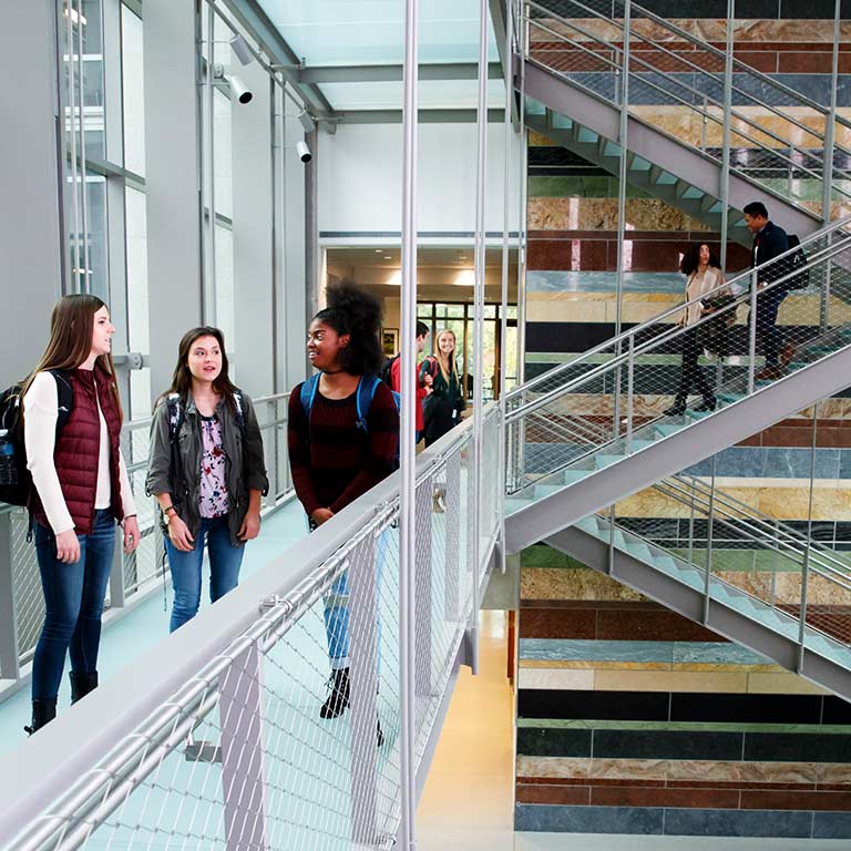 Students talk at the Hamilton Lugar School of Global and International Studies at IU Bloomington.