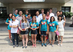 Group of students standing in front of a high school.