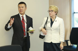 Man and woman standing in a room.