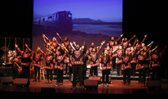 African American choral ensemble on stage.